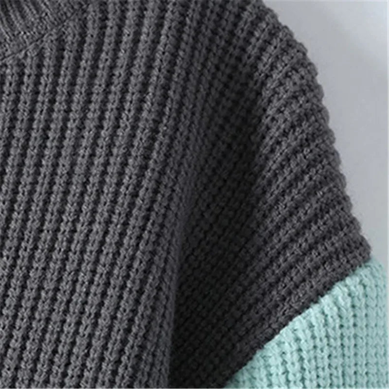 Elegante jersey de cuello alto con diseño patchwork
